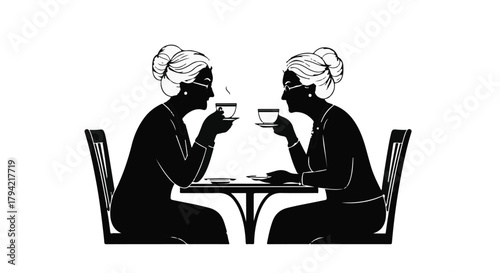 Two women enjoying coffee and conversation at a cafe table.