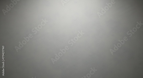 Subtle vignette on a gray wall, creating a soft and diffused light effect