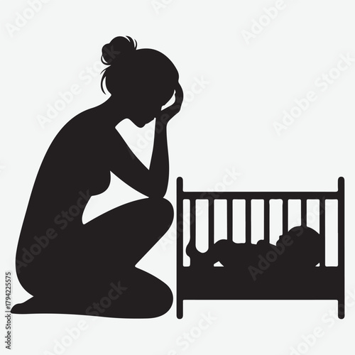 Silhouette of a distressed mother by a baby's crib