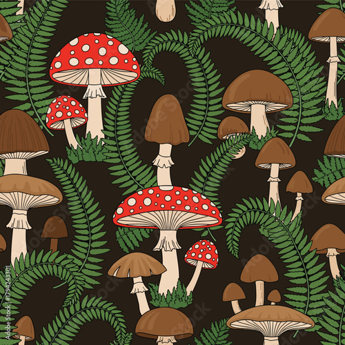 Woodland seamless pattern with red fly agaric mushrooms and brown toadstools growing amongst lush green fern leaves on a dark background.