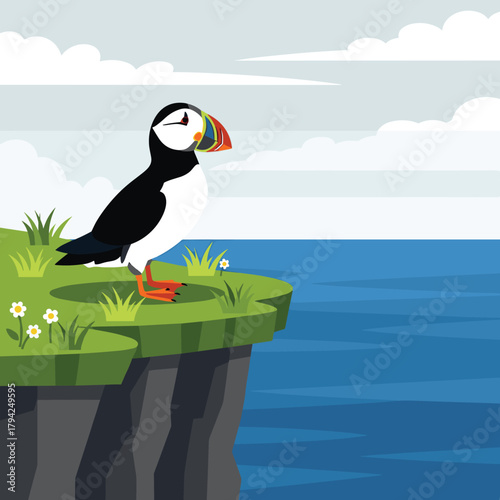 Atlantic puffin with its colorful beak standing on a grassy cliff overlooking a calm blue sea under a cloudy sky.
