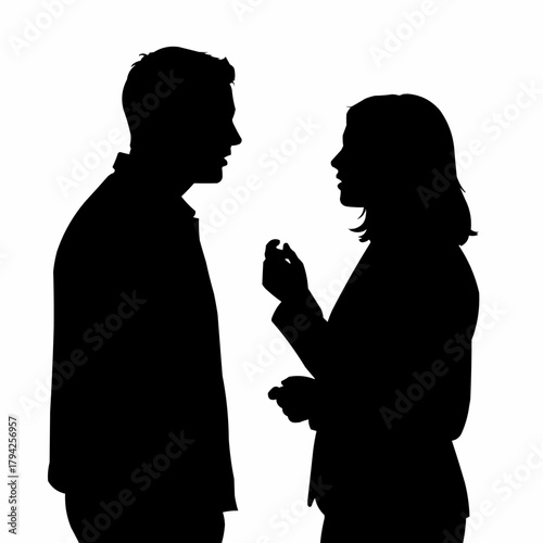 Silhouette of two people engaged in a conversation, discussing ideas.