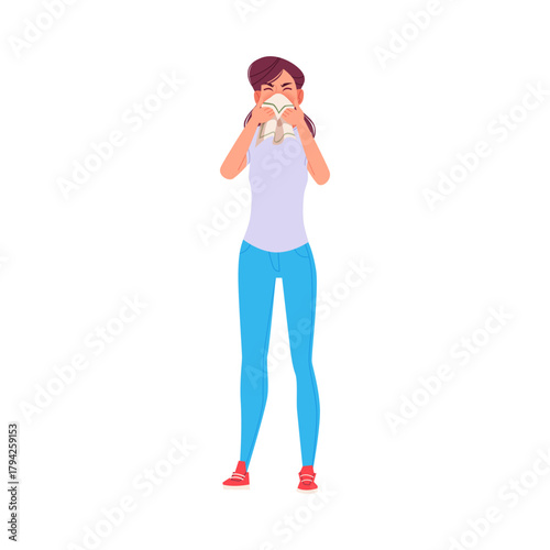 Young Woman Sneezing into Tissue Due to Cold, Flu or Allergy