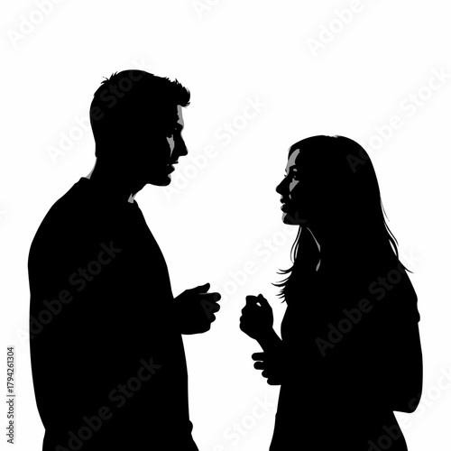 Silhouette of a man and woman having a serious conversation.