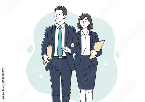 A man and a woman in business attire walking together, holding documents and looking forward with confidence