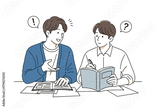 Two young men studying together, one explaining something while the other takes notes