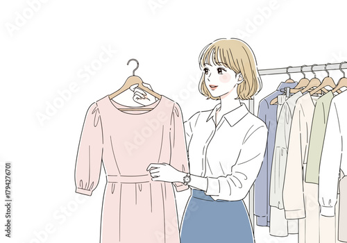 A woman is choosing a dress from a clothing rack in a store, holding up a pink dress and looking at it