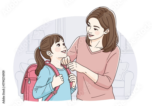 Mother helping her daughter put on a backpack, preparing for school