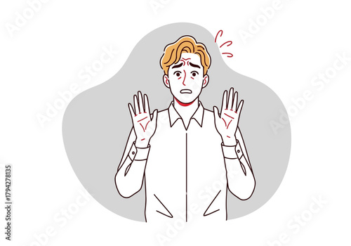 A man with a shocked expression, hands raised in a defensive gesture