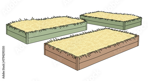 Raised garden beds covered with straw in different colors  