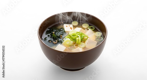 Steaming bowl of miso soup featuring tofu seaweed and green onions a traditional Japanese dish perfect for healthy eating and culinary exploration with authentic asian cuisine