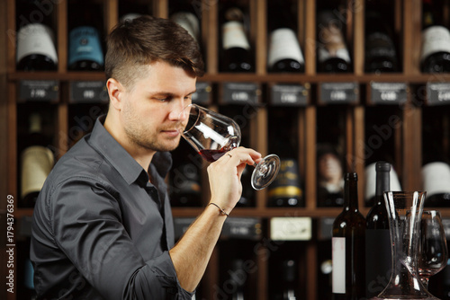 Degustation process of sommelier in wine cellar