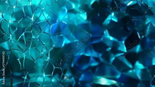 Abstract blue and turquoise glass texture with geometric shapes and patterns.