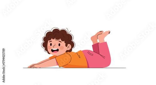 Happy little boy lying on his stomach and propped up on his elbows, doing a gentle backbend or cobra pose during kids yoga.