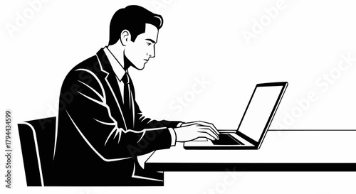 Professional businessman in a suit working on a laptop computer.