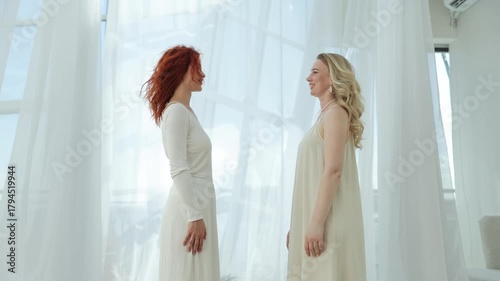 Two women holding hands during spiritual practice symbolizing support, connection, and healing energy