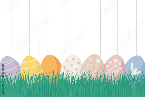 Colorful Easter Eggs Hidden in the Grass in Front of a White Fence for a Festive Spring Holiday Celebration
