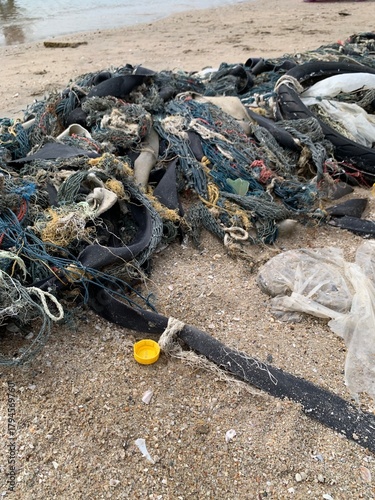 fishing process waste on sand beach background