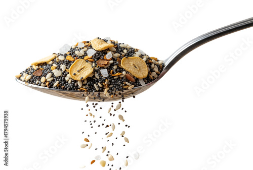 A spoon full of Everything bagel seasoning spilling gently, macro shot