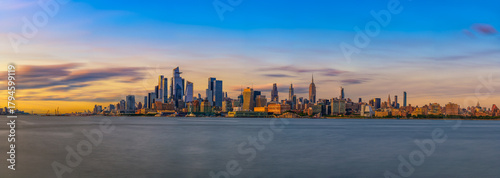 Fotografie Panorama of New York City Skyline with Hudson Yards District and the Empire State Building at Sunset, seen across the Hudson River