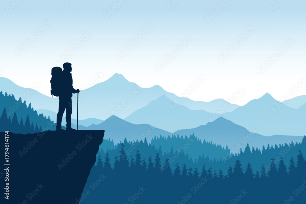 Obraz premium Hiker standing on a cliff overlooking a mountain range