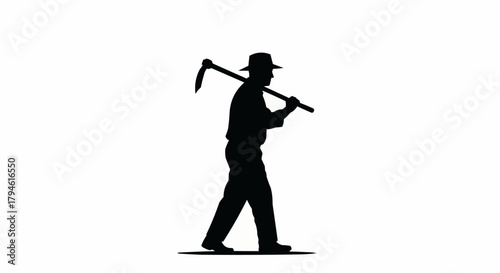 silhouette of a man with a hoe