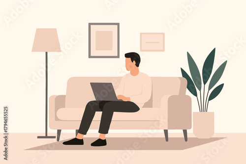 A person sits on a beige sofa in a minimalist living space, typing on a laptop. A floor lamp, framed art, and a large plant create a calm, contemporary home workspace.