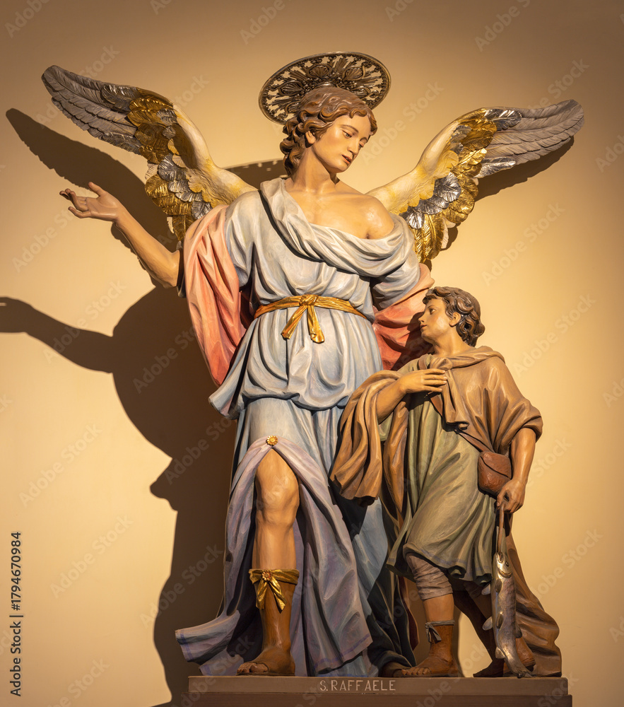 Fototapeta premium CAVA DE TIRRENI, ITALY - OCTOBER 7, 2025:The carved polychrome statue of Guardian angel in the church Chiesa di San Francesco probably by unknown artist.