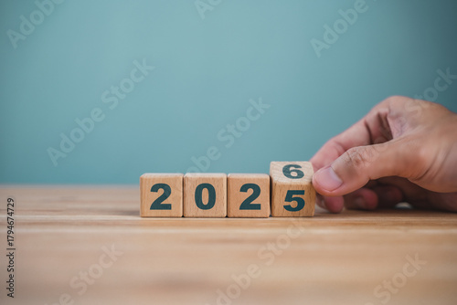 Wooden cube blocks for the transition from 2025 to 2026. Countdown to 2026. Load year from 2025 to 2026. New year start concept.