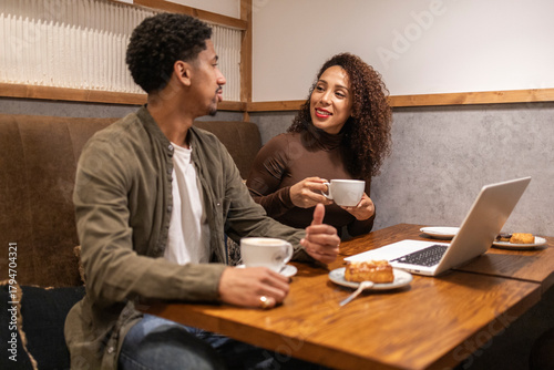 Hispanic couple working in a cafe.