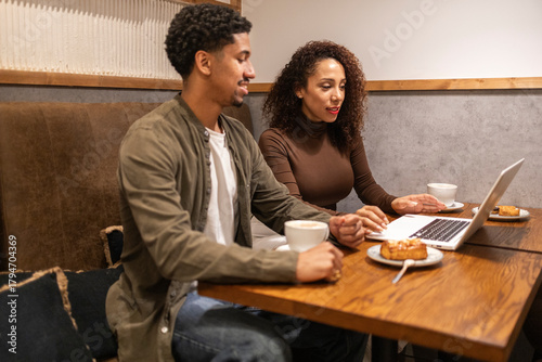 Hispanic couple working in a cafe.
