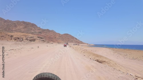 Driving a quad bike in the desert near Dahab, Egypt