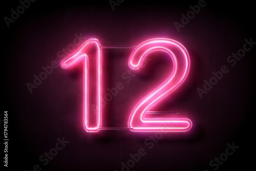 Neon Number Twelve in Bright Pink Illumination on Dark Background