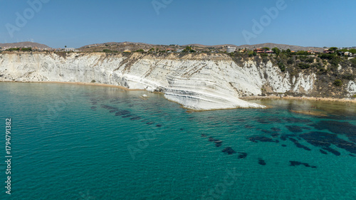 Panorama of the Scala dei Turchi (Stair of the Turks or Turkish Steps) on the coast of Realmonte, near Agrigento, Sicily, Italy. It's a marl cliff and tourist attraction. The sea is turquoise.