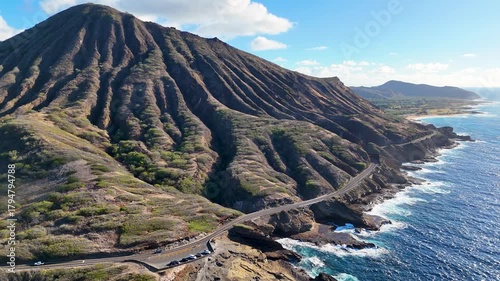 Aerial view of Koko Head & Kalaniana'ole Highway winding along the coast, contrasting with the deep blue ocean and the rugged terrain, Honolulu, Hawaii, United States.