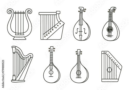 Collection of stringed musical instruments on brown background