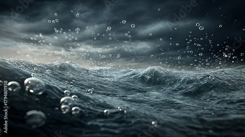 Fototapeta Naklejka Na Ścianę i Meble -  Dynamic ocean waves crash with rising bubbles under a dramatic stormy sky, conveying raw power and natural energy.
