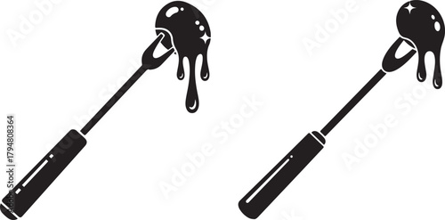 Two chocolate fondue forks with dripping chocolate silhouette