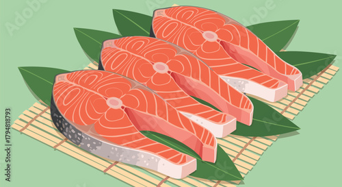 Fresh salmon steaks artfully arranged on a bamboo mat with green leaves.