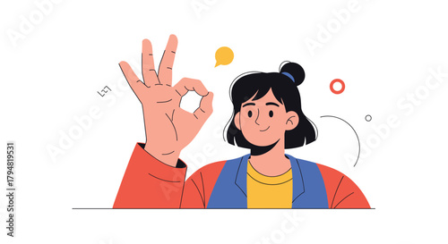 A young woman gives a positive confirmation with her hand gesture and a smile.