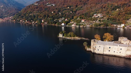 Aerial view of the ancient Castelli di Cannero standing majestically on small islands in Lago Maggiore surrounded by mountains, Cannero Riviera, Piemonte, Italy.
