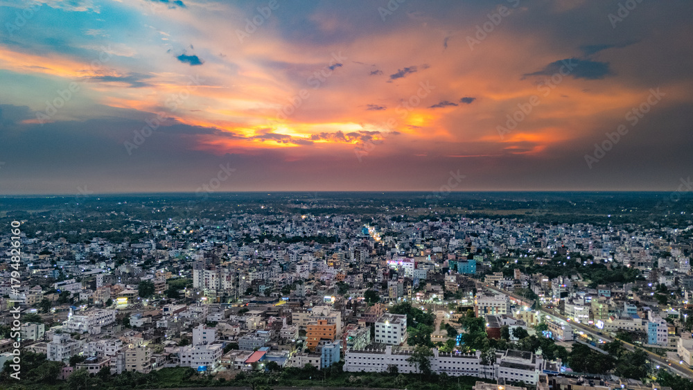 Obraz premium Top down Buildings and Apartment with Multiple Building aerial. Urban Buildings and Apartment at bridge road at Delhi. Cinematic cityscape drone shot. Noida Buildings.