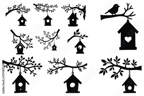 Black silhouette birdhouses hanging from tree branches