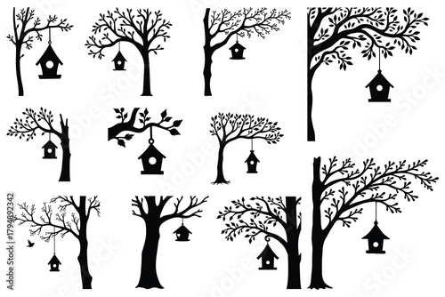 Black silhouette trees with hanging birdhouses and one bird