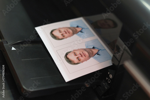 Printing documents on a printer. Photo studio service - creating photos for passports, passes ID cards.