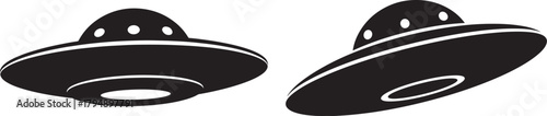 Two stylized black alien spacecraft or flying saucers in silhouette isolated on transparent background
