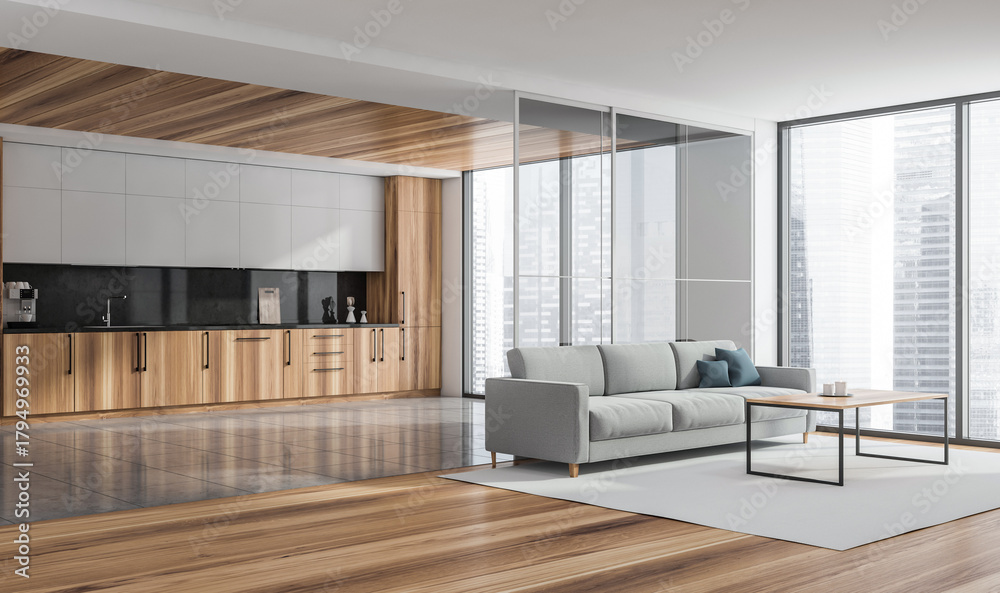 Naklejka premium Corner view of the panoramic living room with grey sofa, kitchen