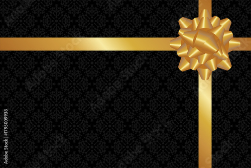 金色リボンの黒い包み紙のギフト