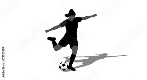 Female soccer player kicking ball in action silhouette with shadow