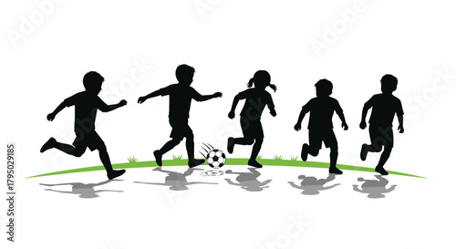 Kids playing soccer silhouette on grass